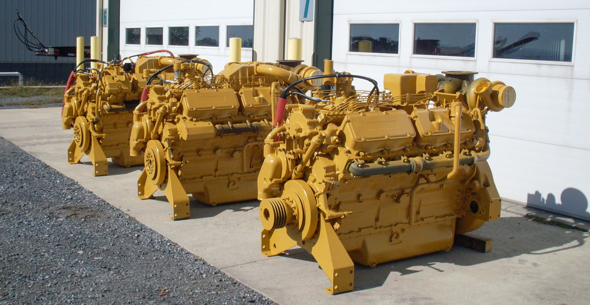3 Caterpillar Engines in front of Timber Ridge's shop