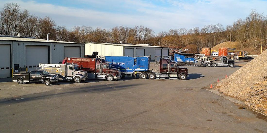 Service trucks in front of Timber Ridge's shop